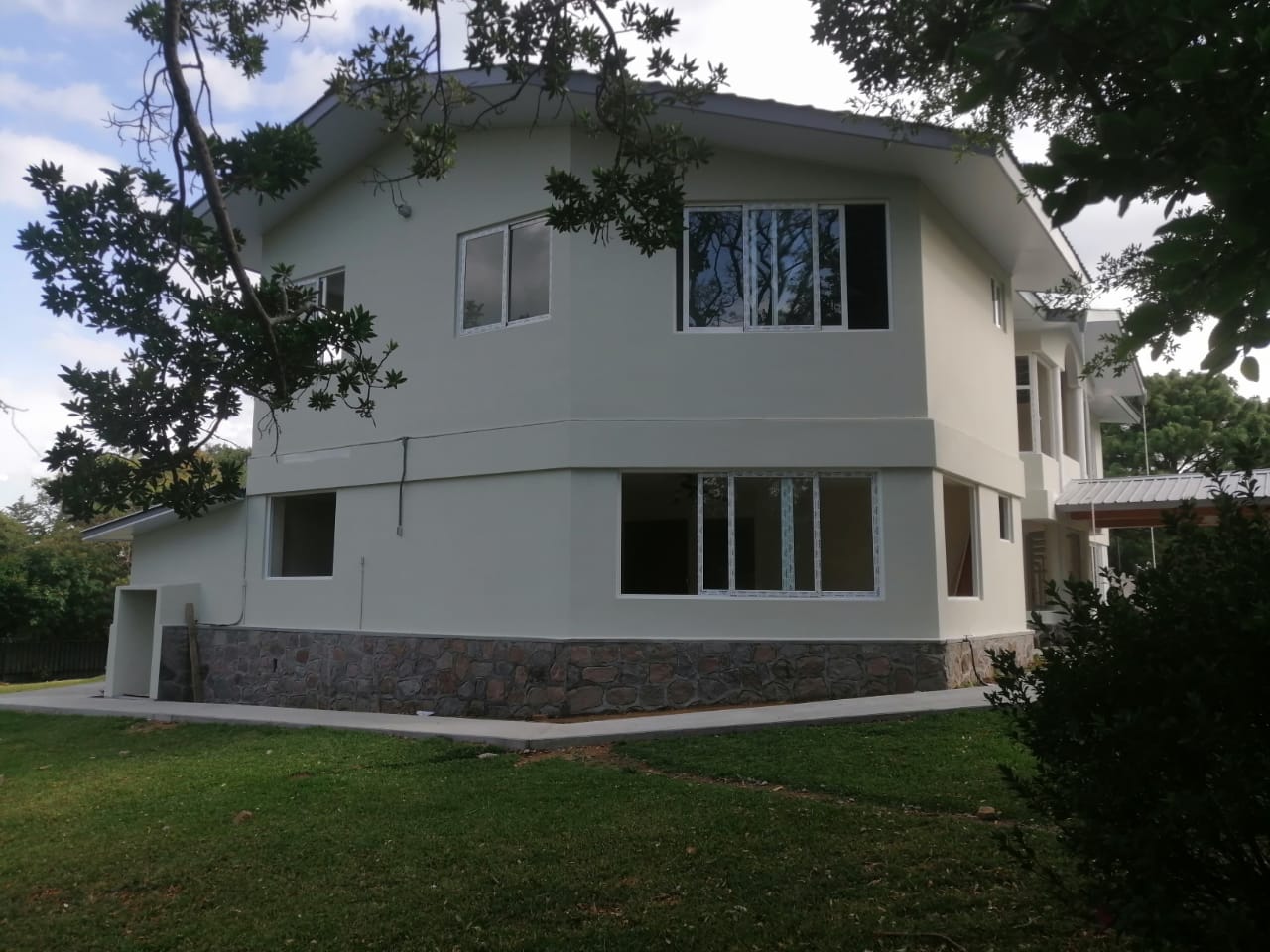 25-year-old villa repositioned into 2 independent family residences, with new upper terrace extension, staircase integration designed to improve livability, flexibility and long-term income potential. Boquete, Chiriquí Province.